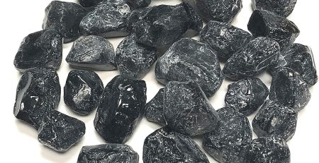 A pile of black rocks on a white background.