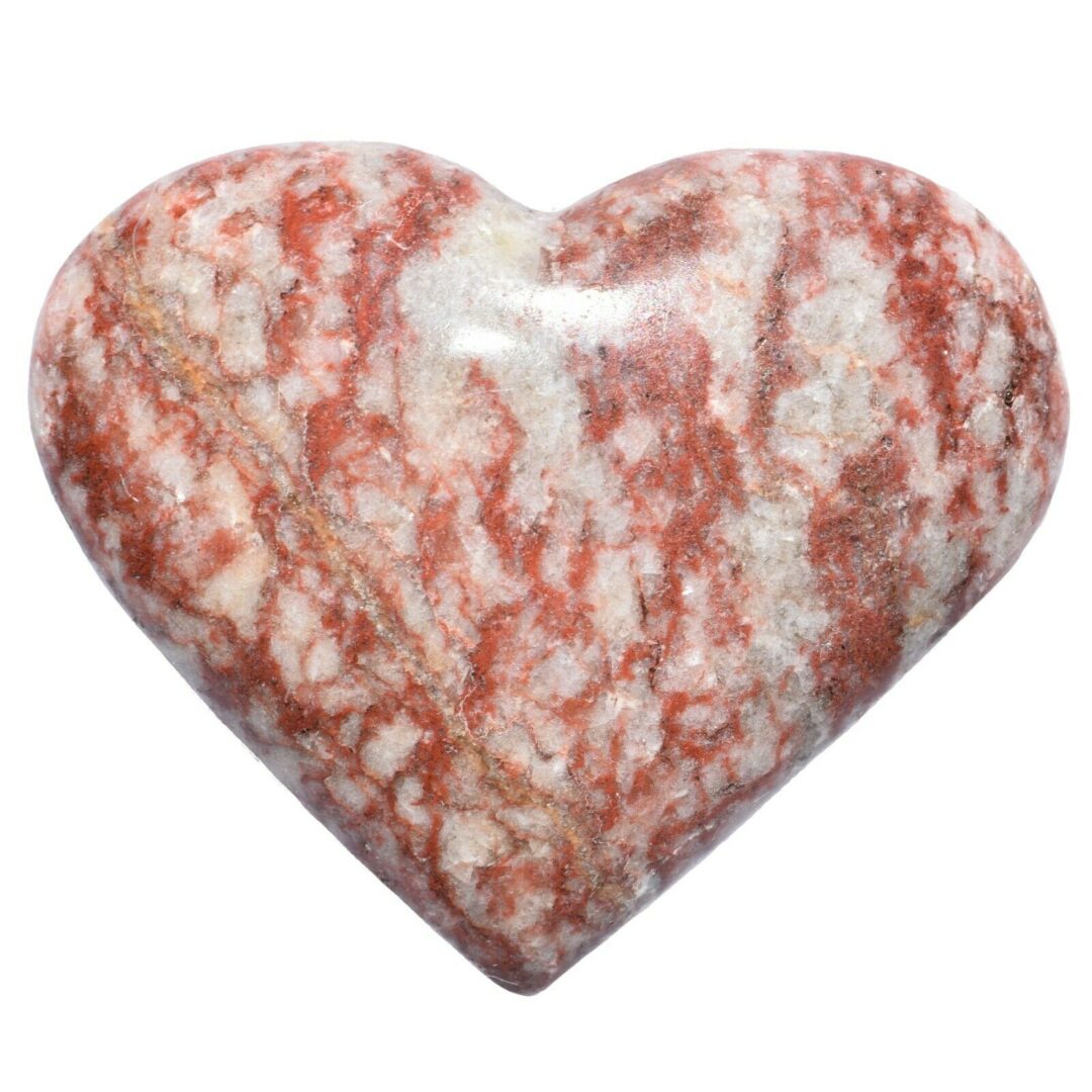 A red and white heart shaped stone on a white background.