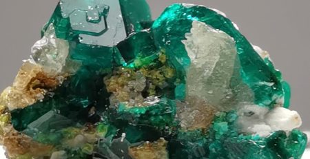 Green and blue crystals of dioptase on white calcite.