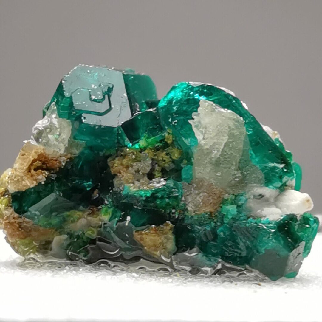 Green and blue crystals of dioptase on white calcite.