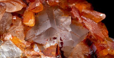 A close up of a cluster of orange crystals.