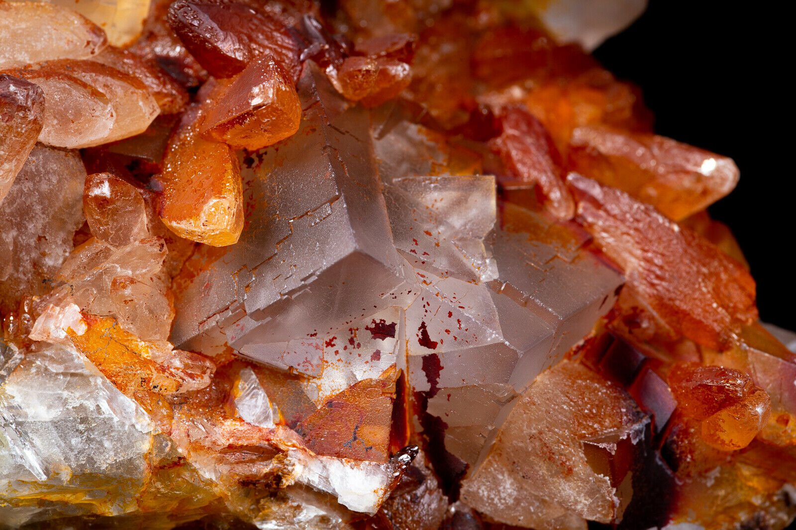 A close up of a cluster of orange crystals.