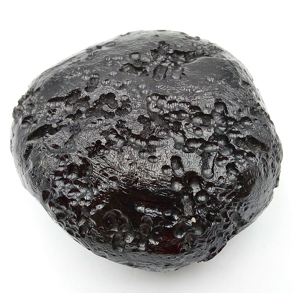 A black rock on a white background.