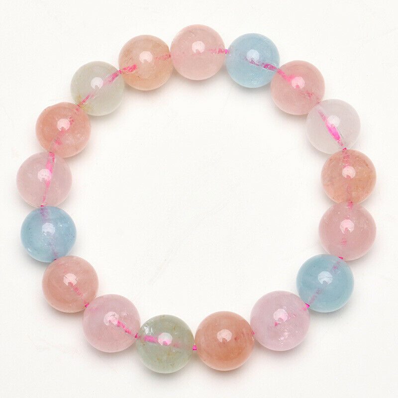 A bracelet with pink, blue and green beads.