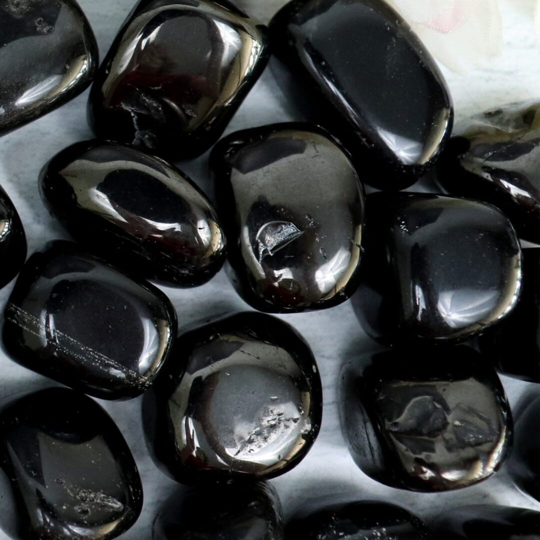 A pile of black stones on a table.