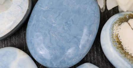 A variety of blue and white stones on a table.