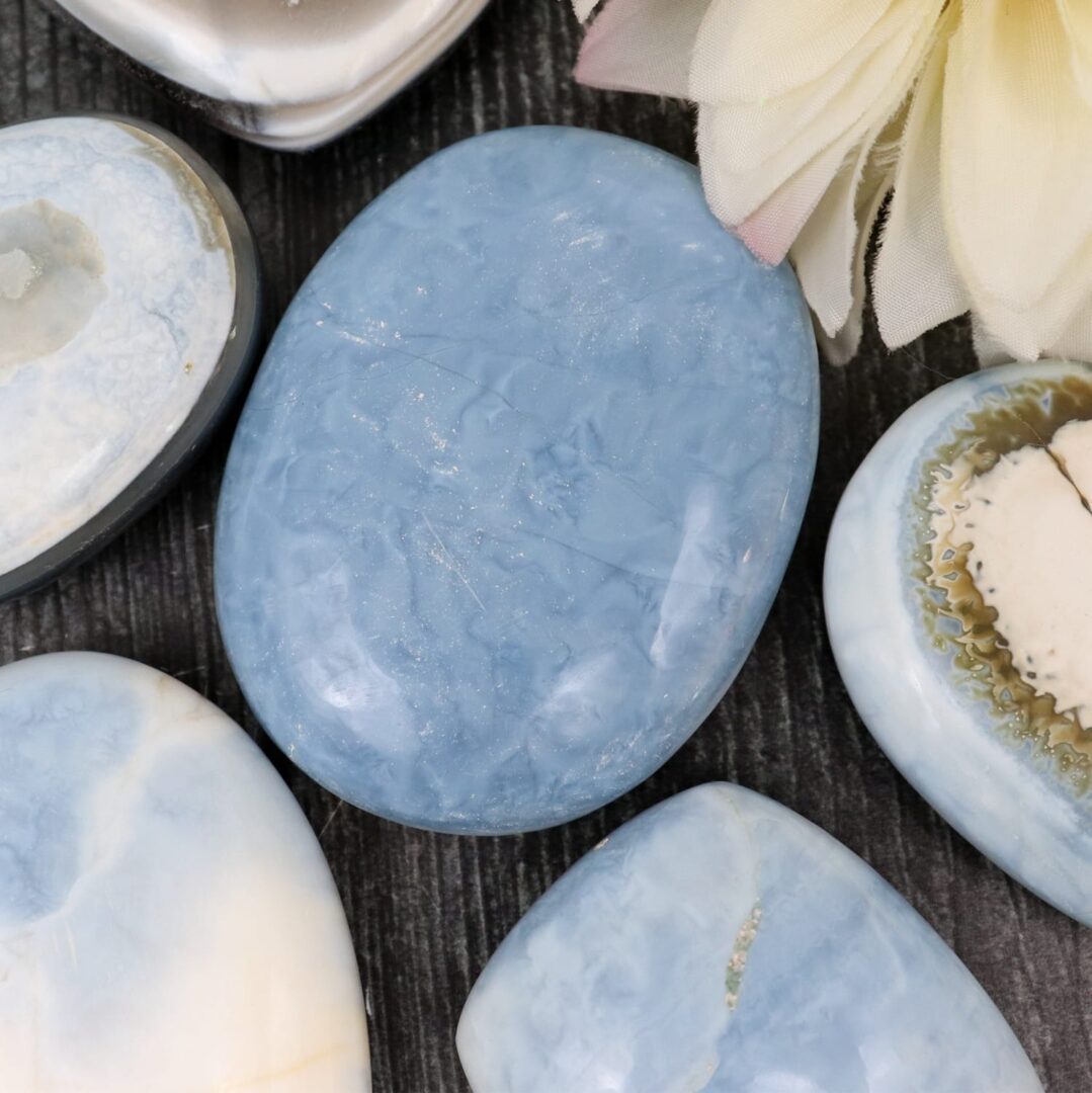 A variety of blue and white stones on a table.