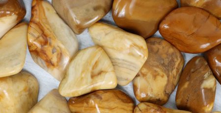 A pile of brown and tan stones on a table.