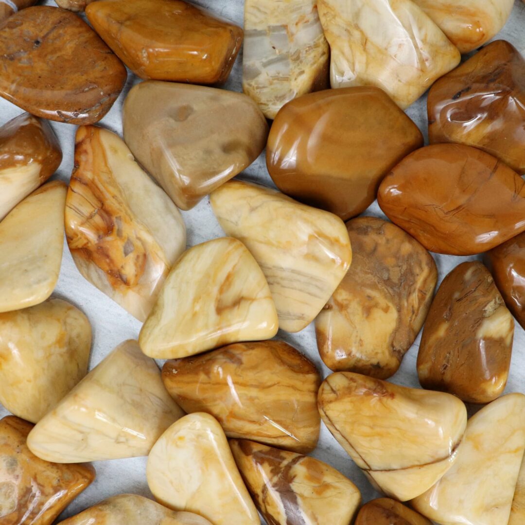 A pile of brown and tan stones on a table.