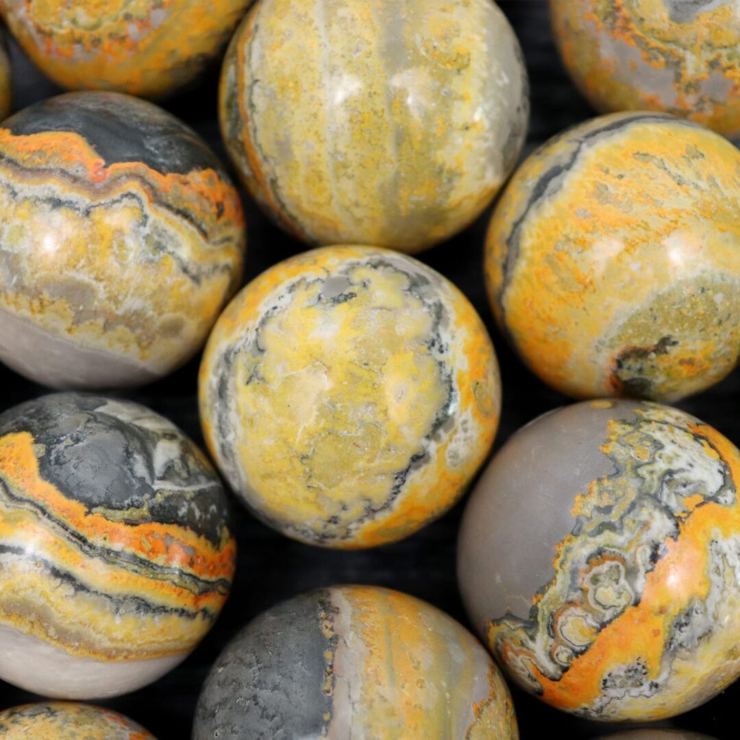 A group of yellow and black marble spheres.