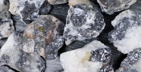 A pile of white and black rocks on a table.