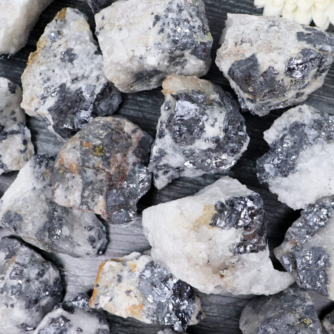 A pile of white and black rocks on a table.