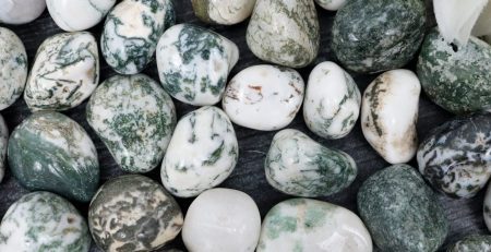 Green and white marbled pebbles with a flower.