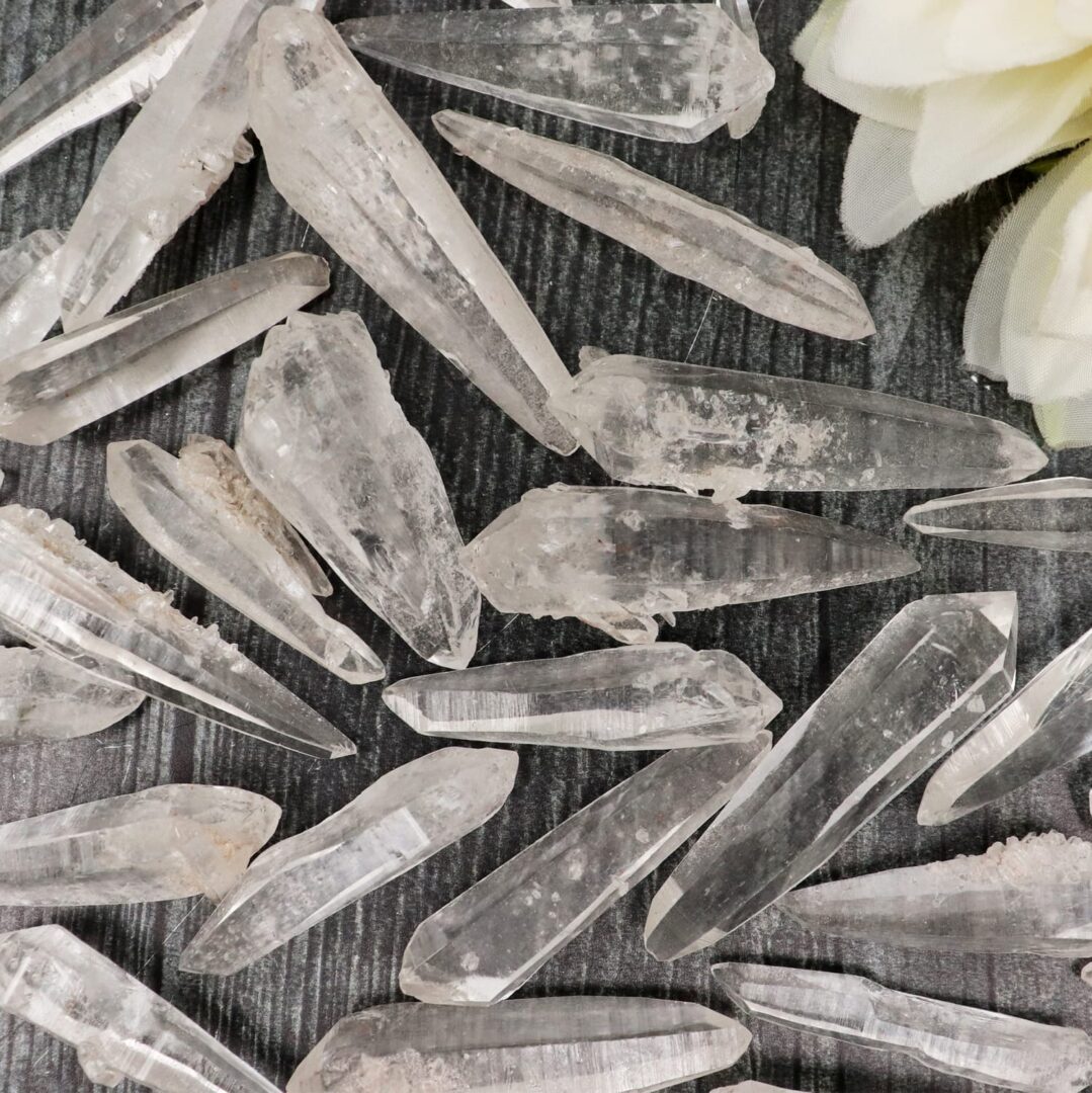 A bunch of crystal points on a table.