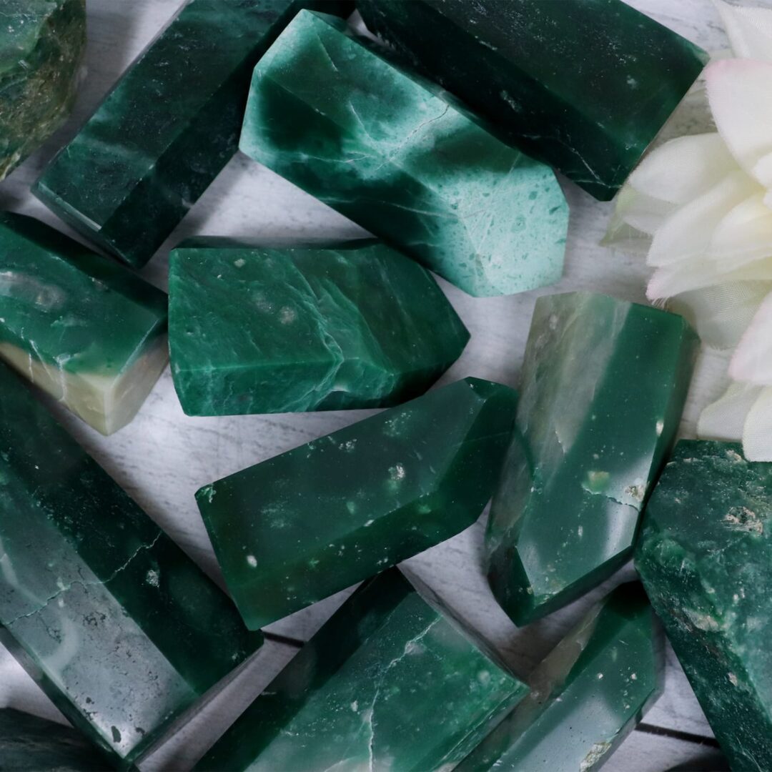 Emerald green jade crystals with a flower in the middle.