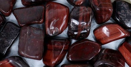 A pile of red and brown tiger eye stones.