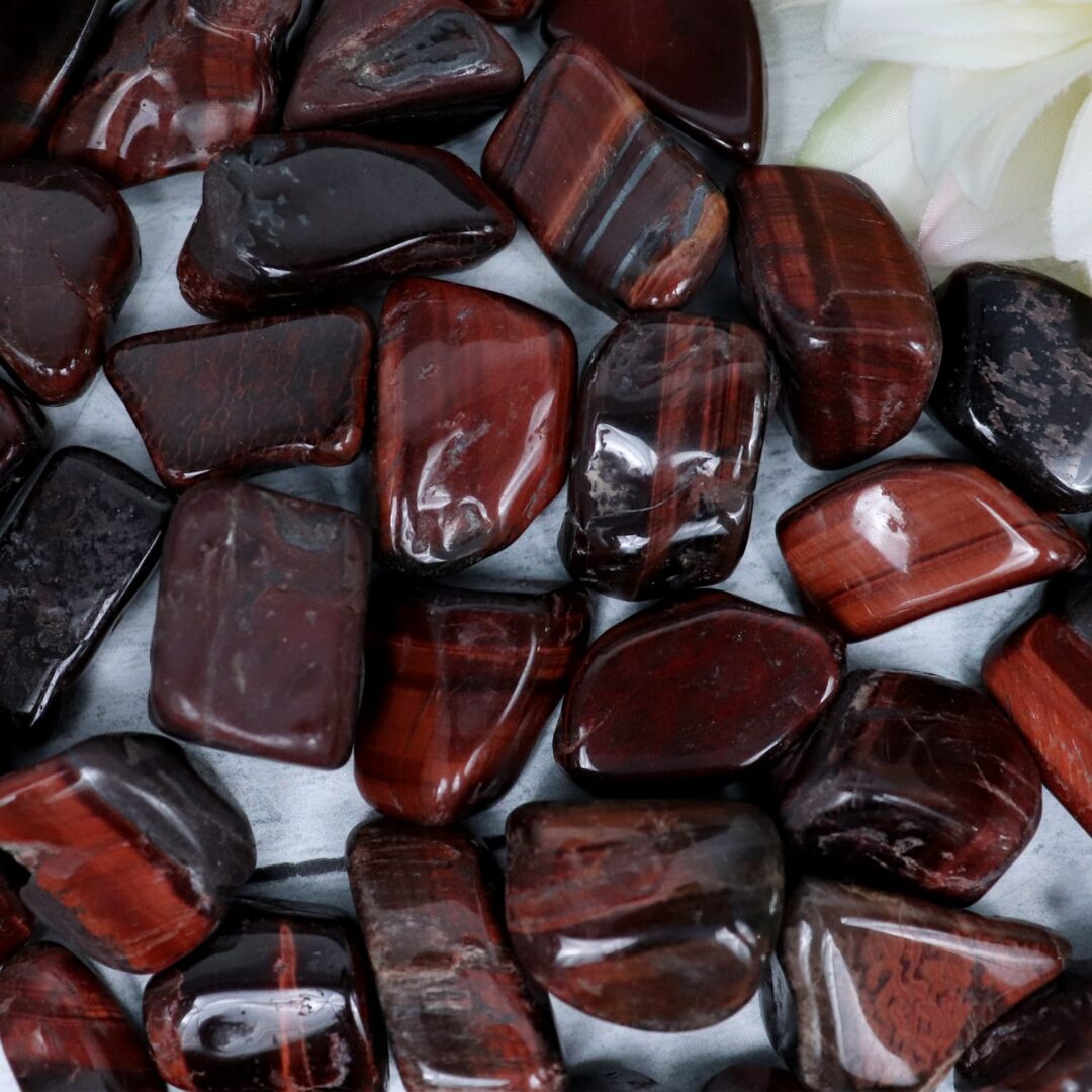 A pile of red and brown tiger eye stones.