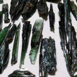 Green and black mineral crystal specimens.