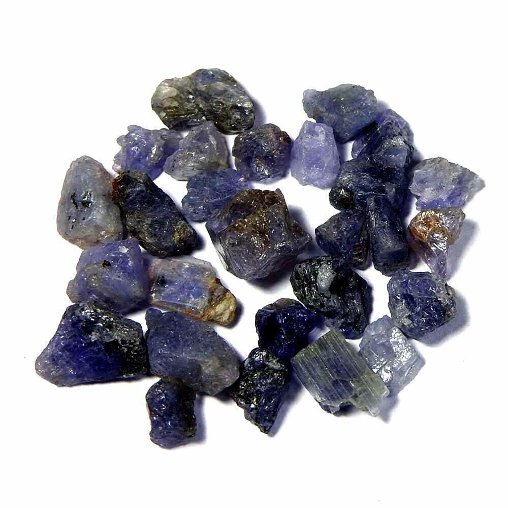 A bunch of blue and purple crystals on a white background.