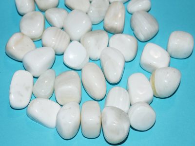 White pebbles with a ruler next to them.