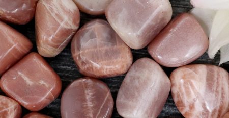 A pile of pink and brown stones on a table.