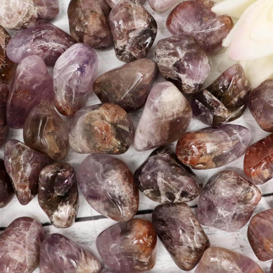 Purple amethyst crystals on a white table.