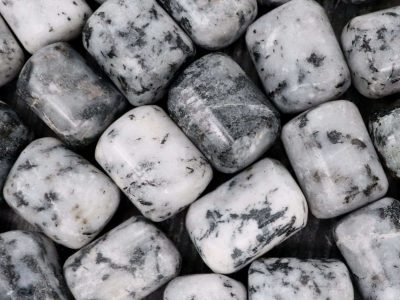 A close up of white and black marble beads.