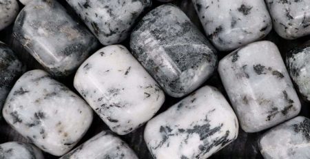 A close up of white and black marble beads.