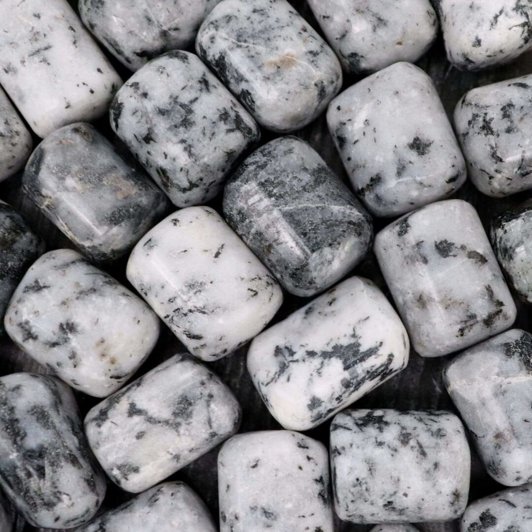 A close up of white and black marble beads.