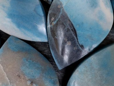 A group of blue and white marble pieces on a table.