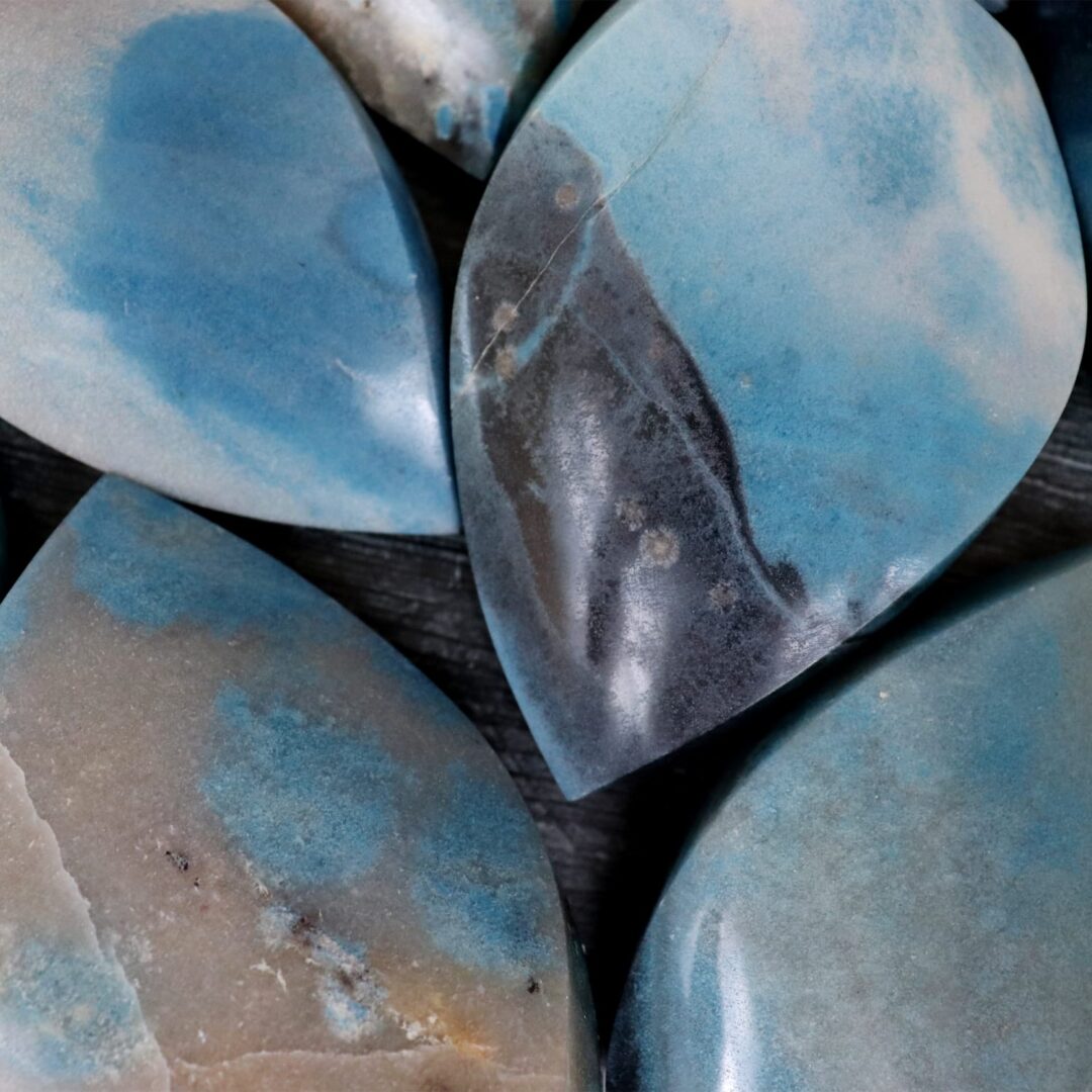 A group of blue and white marble pieces on a table.