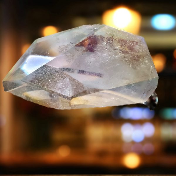 Clear crystal with iridescent facets.