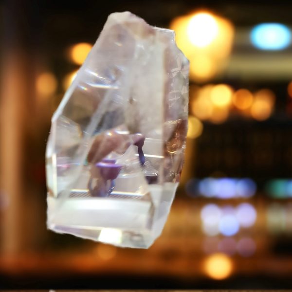 Clear crystal prism with blurred lights.
