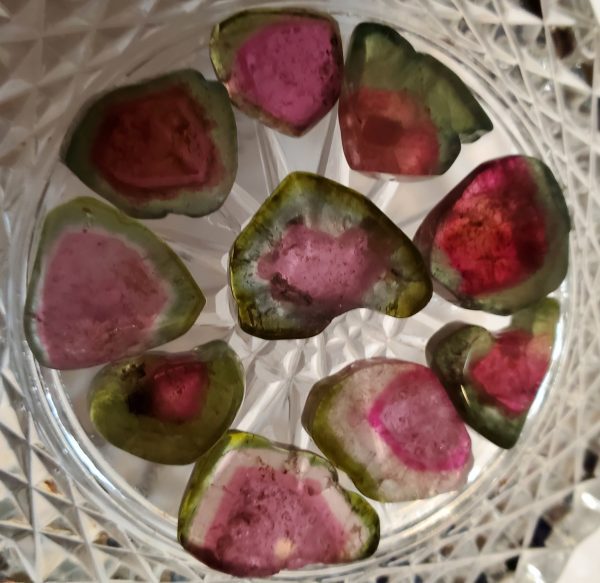 Slices of watermelon tourmaline gemstones.