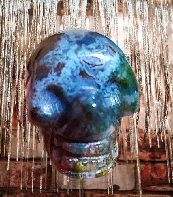 Agate skull with blue and green swirls.