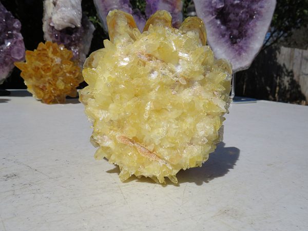 A close-up of a yellow crystal cluster.