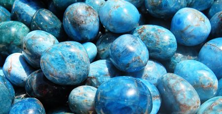 A pile of blue apatite gemstones.