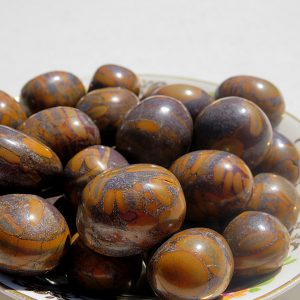 Brown and grey patterned stones in a bowl.