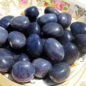 Blue gemstone tumbled stones in a bowl.