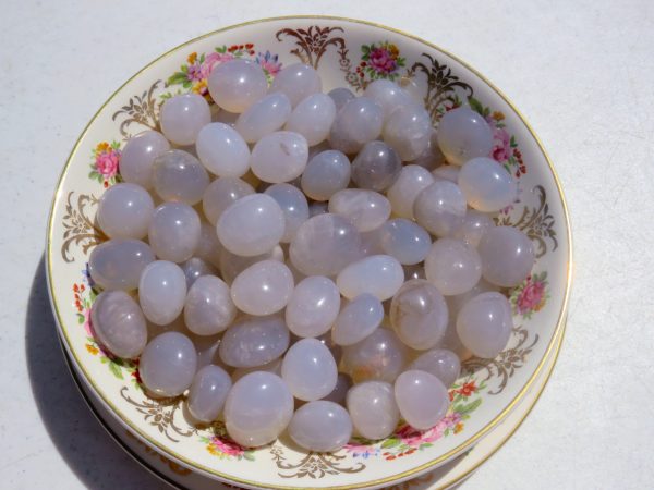 White agate stones in a floral bowl.