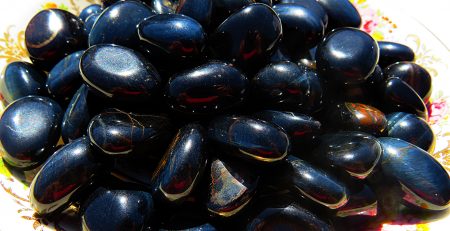 A pile of shiny black stones.