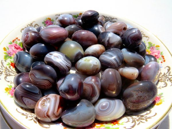Polished agate stones in a bowl.
