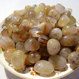 Golden Rutilated Quartz tumbled stones.