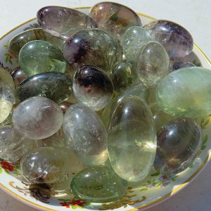 Green and purple gemstone tumbled stones.