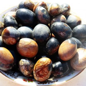 Polished brown and black agate stones.