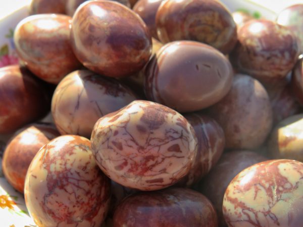Close-up of smooth, red and white stones.