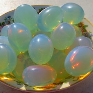 Green and blue iridescent stones in a bowl.