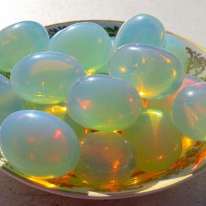 Bowl of iridescent green and blue stones.