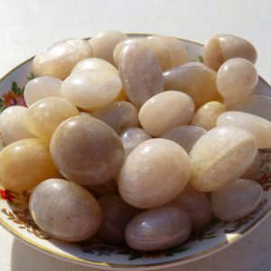 Bowl of smooth, translucent white stones.