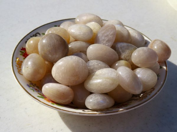 Smooth white and gray stones in a bowl.